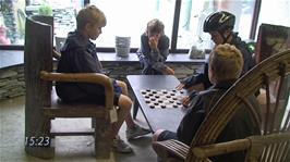Olly and Freddie playing Slate Draughts at the Honister Slate Mine